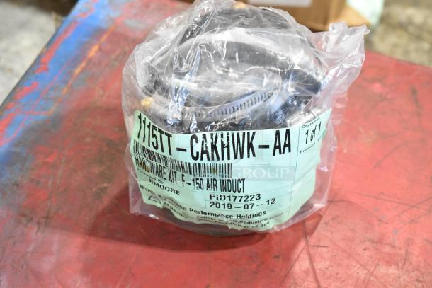 Bag of parts with 1115TT-CAKHWKB-AA cold air intake kit for F-150, labeled PID177223. Sealed in clear packaging.