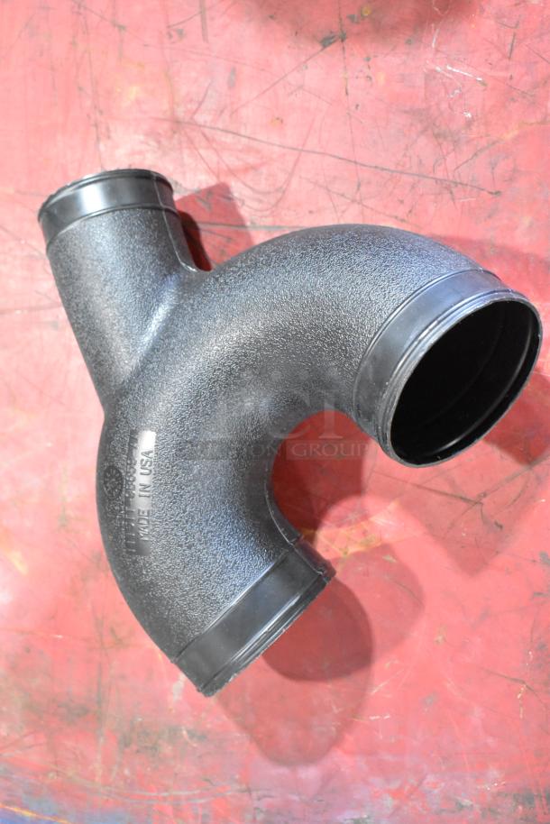 Box of parts featuring a 1115TT-CAKHWKB-AA cold air intake kit, black Y-shaped component, marked "Made in USA."