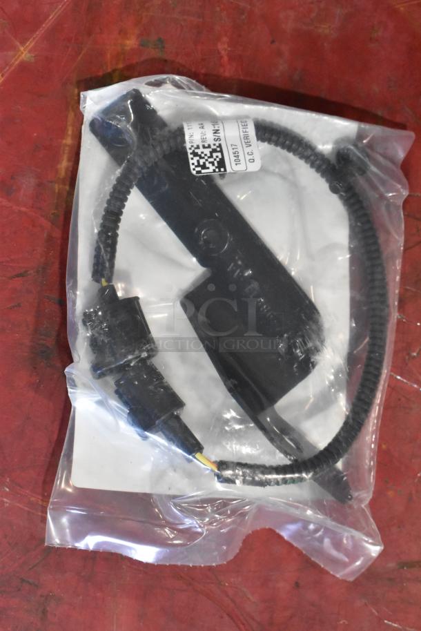 Box of parts with 1115TT-CAKHWKB-AA cold air intake kit, sealed in plastic bag, includes black connectors and tubing.