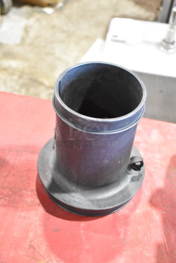 Box of parts featuring a 111550-CAKHWX-AA cold air intake kit, shown in fair condition. Black tubular component on a red surface.