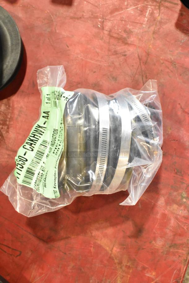 Box of parts including 111550-CAKHWX-AA Cold Air Intake Kit, sealed in plastic, with green label showing item number.