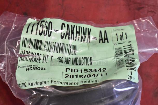 Box of parts with 111550-CAKHWX-AA cold air intake kit, packaged by RCMOSL. Label shows it as hardware kit for F-150 air induction.