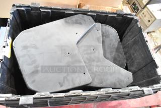 Box of GMC panels in black poly bin, panels have pre-drilled holes, used condition, suitable for parts replacement.