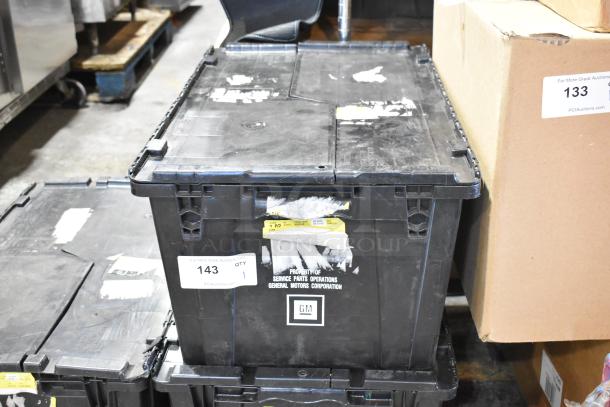 Box containing GMC panels in a black poly bin. Markings: "Service Parts Operations General Motors Corporation." Condition: used.