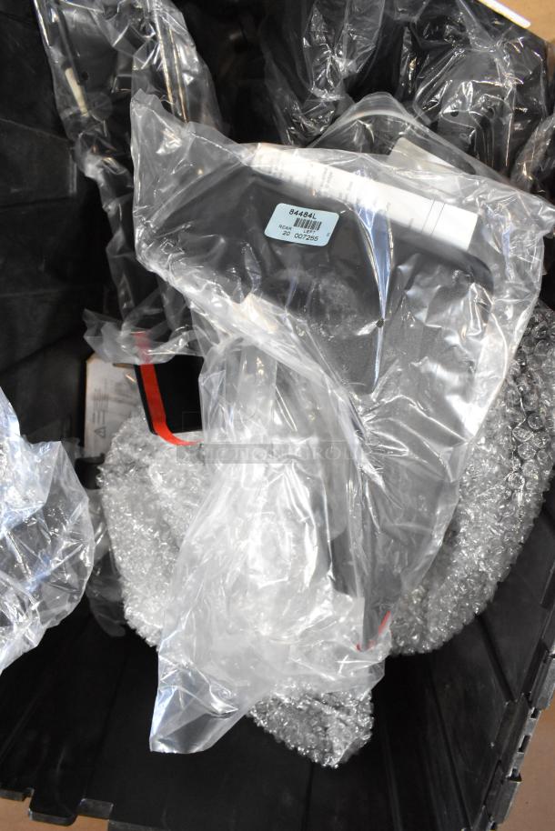 Box of GMC panels in black poly bin, wrapped in protective plastic and bubble wrap, with label "84484L Rear".
