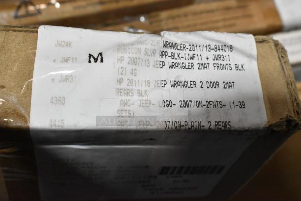Box label detailing Jeep Wrangler floor mats, new condition, minor scratches and dents. Multiple models included.