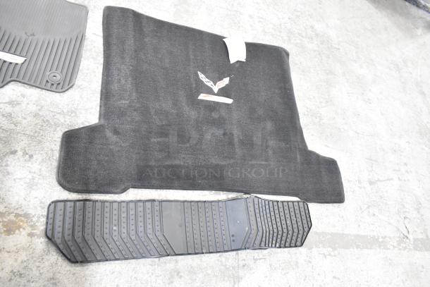 22 assorted car floor mats including carpet and rubber styles, featuring logo details, suitable for various vehicles.