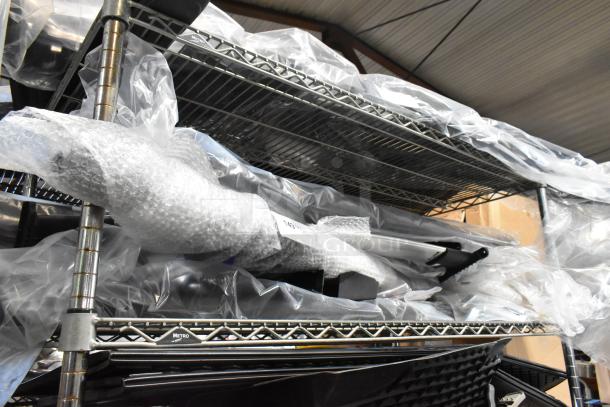 Shelving unit with 10 various items, including a screen, wrapped in protective plastic and bubble wrap. Items appear in good condition.