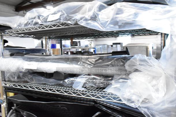 10 various items on metal shelves, wrapped in plastic and bubble wrap. Some tags visible, indicating stored inventory.
