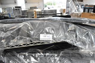Plastic-covered car floor mat, lot tag "150 APX X3". Warehouse setting, items appear in unused condition.