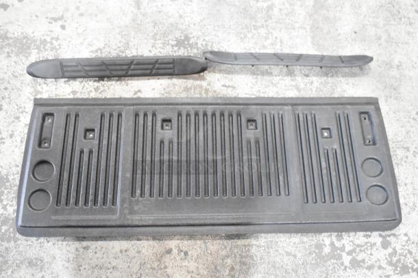 Three black car floor mats, featuring grooved texture for traction, in good condition, auction item for three times your bid.