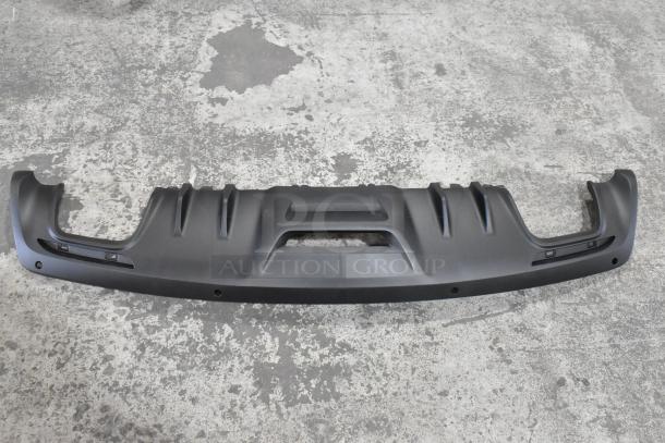 Black car floor mat with textured grip and raised edges, suitable for vehicle interiors. Appears in good condition.
