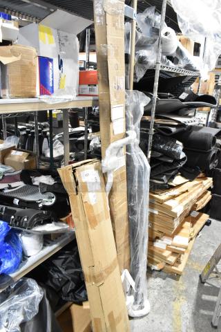 4 various items including screen, stored in warehouse. Boxes show wear. Includes Skechers and Aldaco labels.