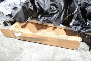 Cardboard box containing car floor mats, showing minor wear. Includes label with quantity "152."