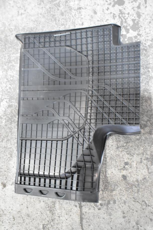 Box of black car floor mats with grid pattern, in new condition. Durable material, non-slip surface, perfect fit design.