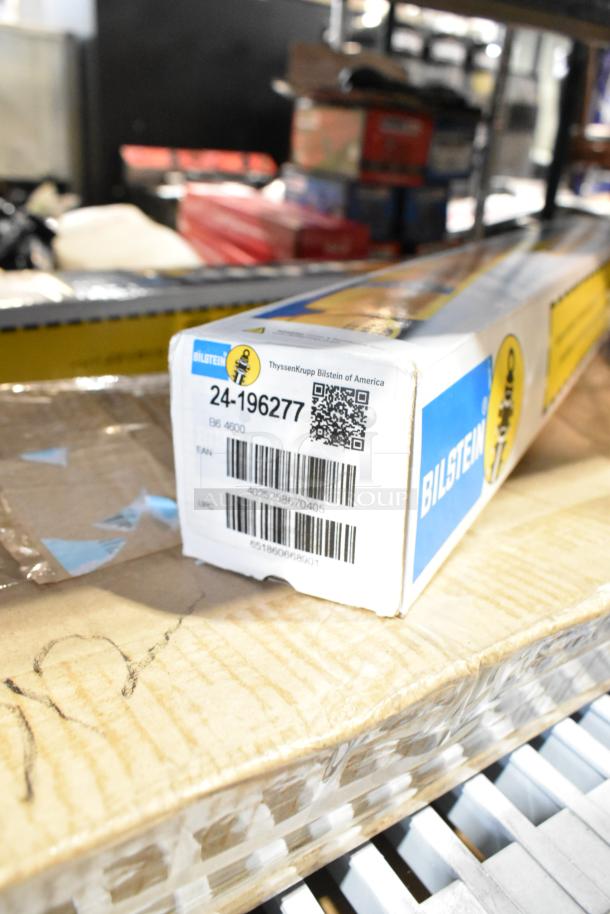 A Bilstein box labeled "24-196277 B6 4600" from ThyssenKrupp Bilstein of America, part of a tier lot with various items.