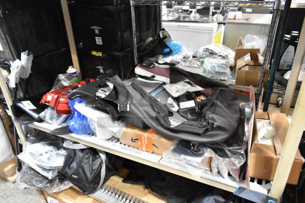 Tiered storage shelves with various items, including kit 111550-CAKHWK-AA. Mixed condition, some items in packaging.