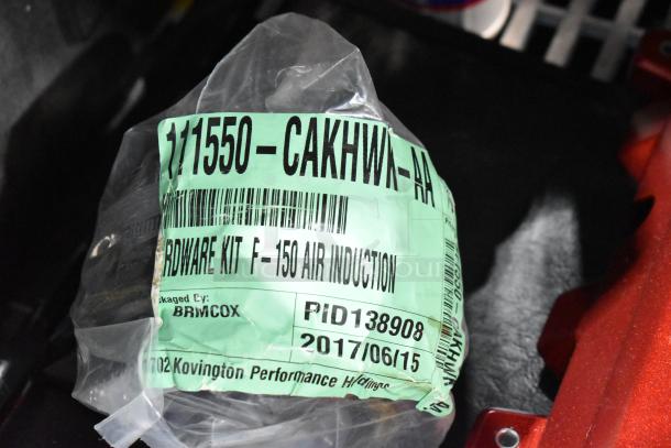 Close-up of 111550-CAKHWK-AA kit packaging, labeled as hardware kit for F-150 air induction, dated 2017/06/15.