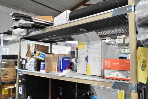 Alt Text: Shelving with various items, including TRU RED printer paper, ACDelco car parts, and Skechers box, in assorted boxes.