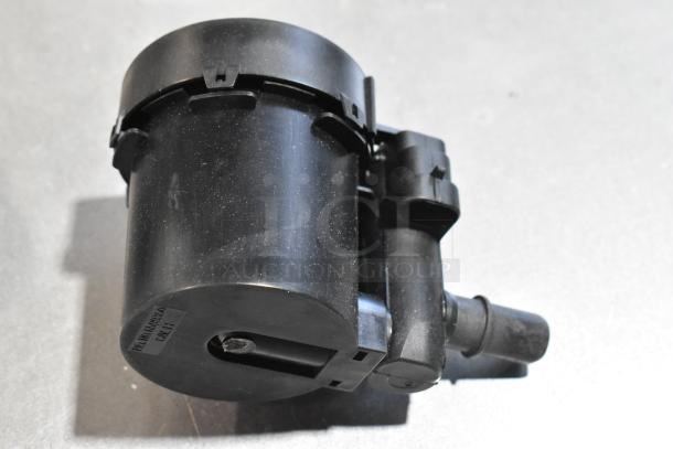 Black cylindrical car part with attached hose connector, labeled PN:AV6N9G866BB. Used condition. Part of mixed auction lot.