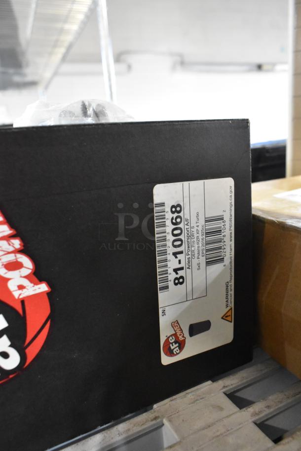 Alt text: "Box with aFe Power label, model number 81-10068, part of a tier lot including printer paper and car parts."