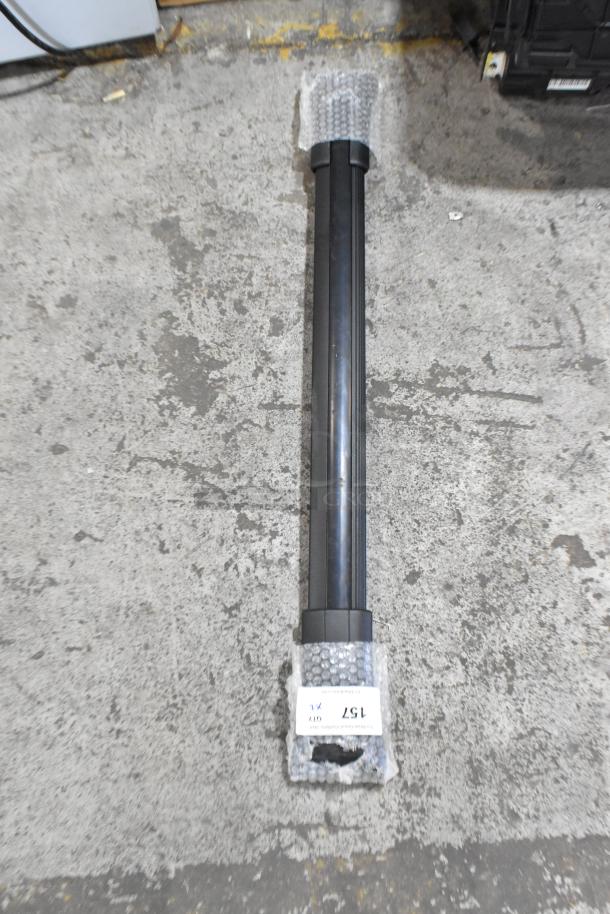 Two black cylindrical items with protective bubble wrap at ends, labeled "157." Suitable for various uses. Condition appears good.