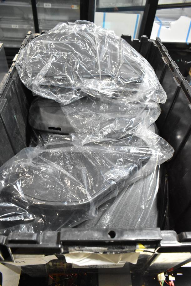 Lot of various items including GMC panels in a black poly bin, wrapped in plastic, used condition.