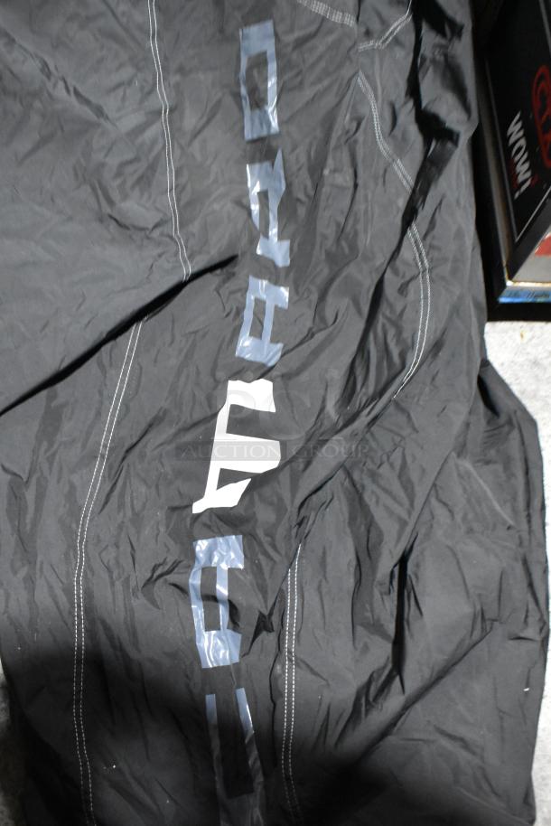Black Camaro car cover with visible logo and stitching. Appears new with possible scratch and dent condition.