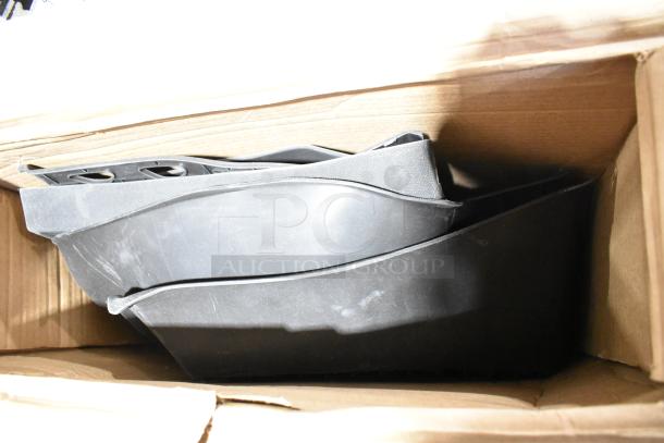Brand new scratch and dent floor mats in a cardboard box.