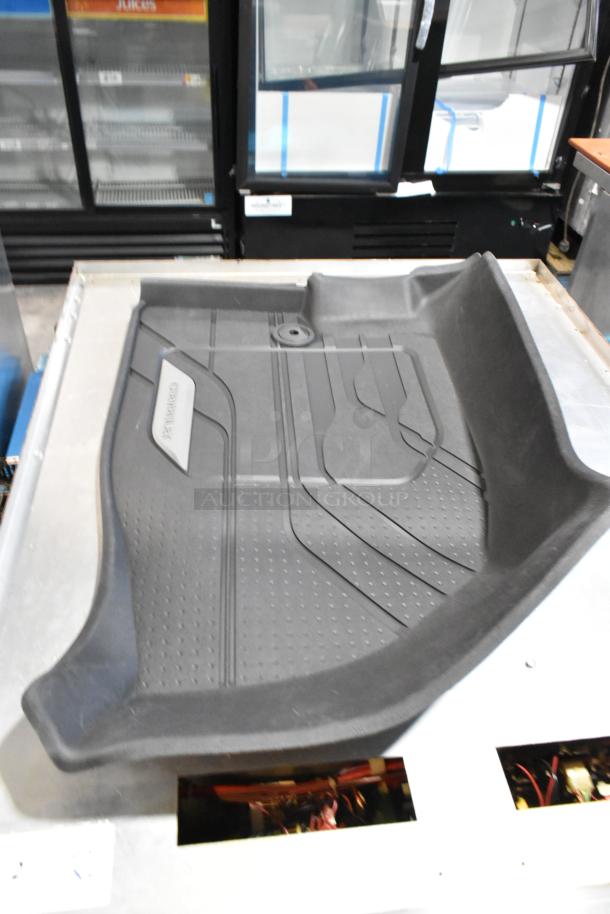 Brand new floor mat with Camaro label, scratch and dent condition, part of auction lot with Camaro cover.