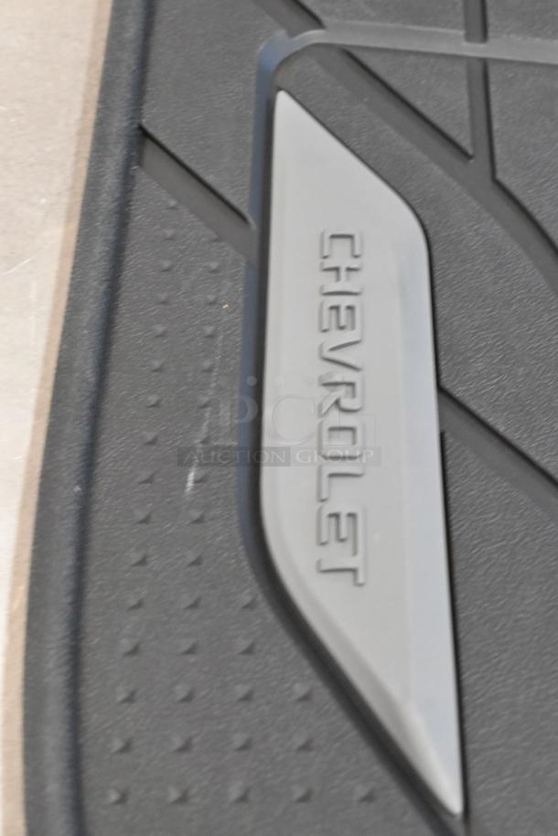 Brand new Chevrolet floor mat with logo detail, part of a scratch and dent auction lot, in excellent condition.