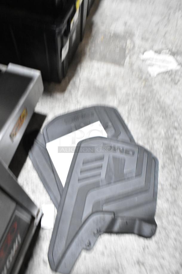 Tier lot including various items, prominently featuring GMC car floor mats, black, in fair condition.