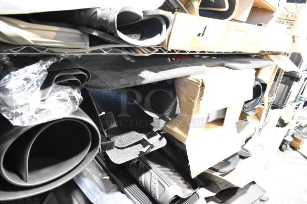 Tier lot of various items including rolled and flat car floor mats, assorted materials. Boxed and loose, used condition.