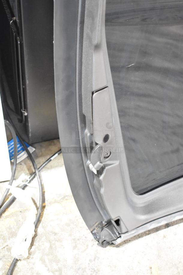 Close-up of a car panel in good condition, showing the edge and mounting points. No visible labels or markings.