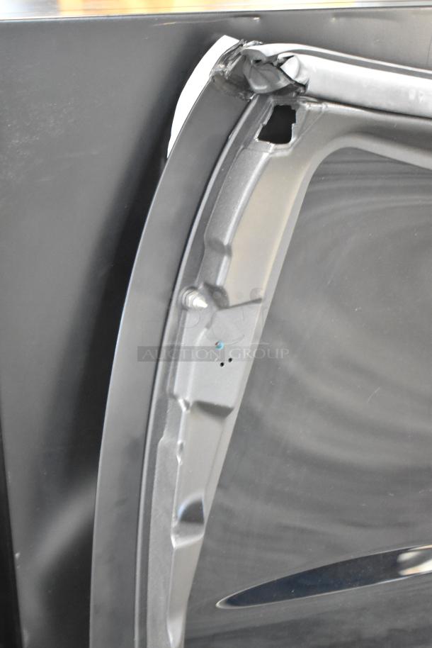 Car panel, black metal, new condition, features mounting holes and sleek design, suitable for vehicle body repair.