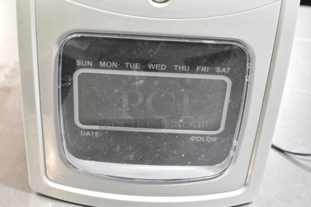 Costway Electric Time Recorder, features days of the week display, slight surface wear visible, no text shown.
