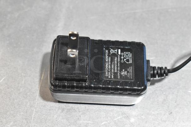 Power adapter for Costway Electric Time Recorder, Model JOD-18-130100V; 100-240V input, 13V output. Appears in good condition.