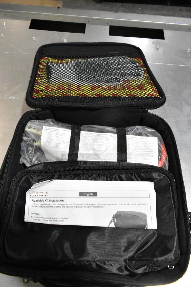 Cadillac roadside kit in black case, contains safety and emergency items. Includes installation instructions.