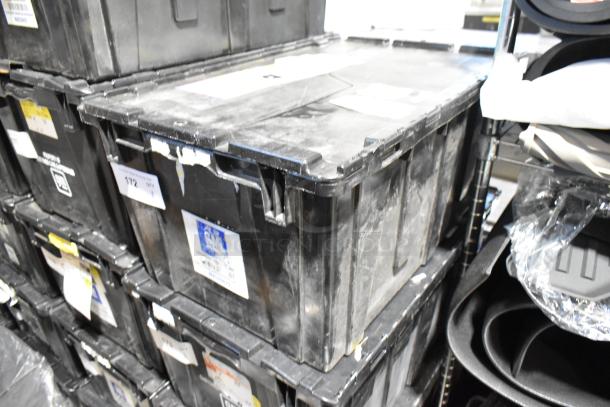 Stacked black poly bins containing various items including ACDelco Ultraguard Oil Fluid, labeled with inventory tags.
