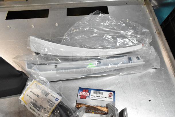 Lot of various items including ACDelco Ultraguard oil fluid, Quad Pack Data Harness, and other automotive parts in a black poly bin.