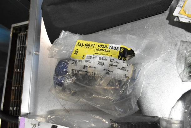 Lot of various items including ACDelco Ultraguard Oil Fluid in black poly bin, visible labeled packaging.
