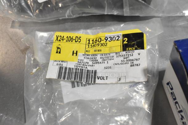 Black poly bin with cargo net, labeled "X24-106-D5 1160-9302," includes part for Toyota, dated 02/19.