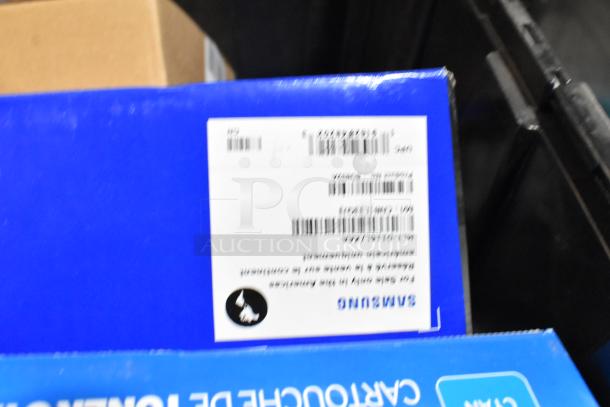 Lot of various items in black poly bin including Samsung CLT-C504S/XAA toner cartridges in packaging with barcode.