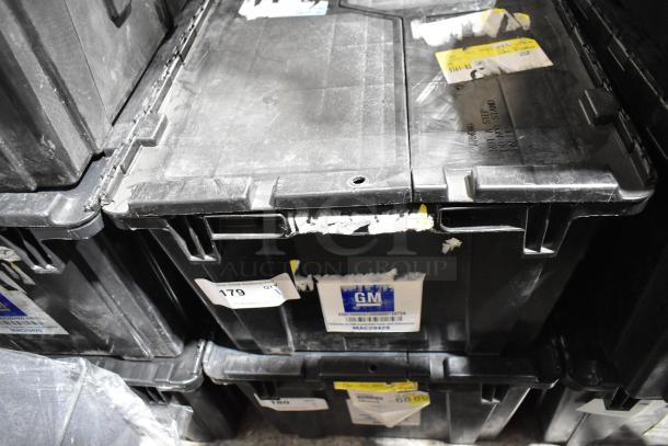 Black poly bin containing various items, including 22935639 mud flaps. Visible labels include GM barcode and lot number.