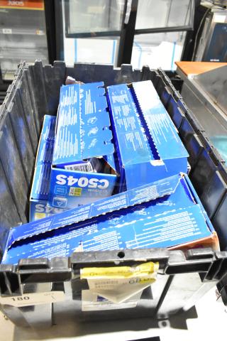 Lot of various items including Samsung C504S ink cartridges in black poly bin. Boxes appear unopened.