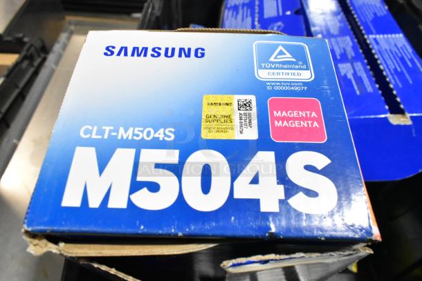 Samsung CLT-M504S Magenta Ink Cartridge, with TÜV Rheinland certification label, in Black Poly Bin. Box slightly worn.