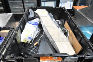 Lot of various items in a black poly bin, including ZP505 label printer, keyboards, and assorted cables. Marks indicate mixed condition.