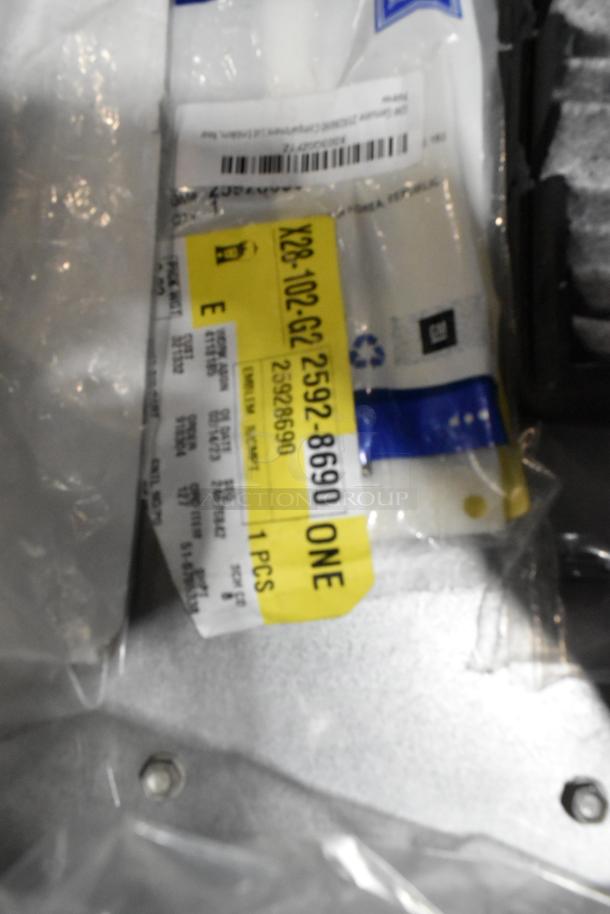 Poly bin containing ZP505 label printer, keyboards, and assorted items with visible barcode label showing product details.