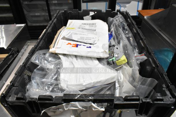 Black poly bin containing various items, including ACDelco Dexron LS gear oil and a Brother label printer.