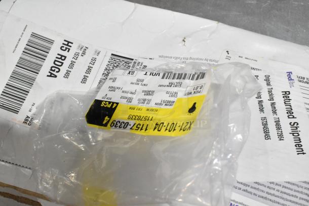 Lot of various items including ACDelco Dexron LS Gear Oil and Brother label printer in black poly bin; shipping labels visible.